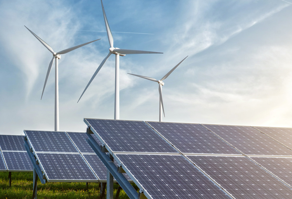 Solar panels and wind turbines symbolizing MicroControl solutions for power generation